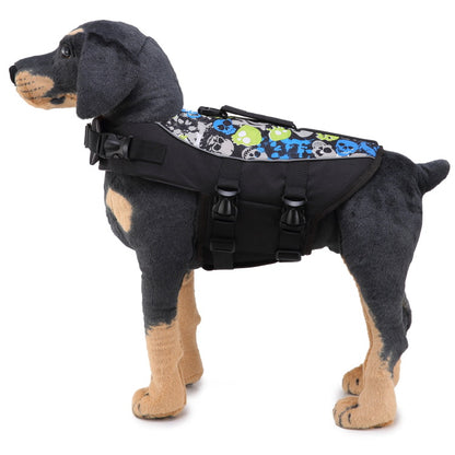 Dog wearing a black life jacket with colorful skull pattern on a white background