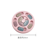 Pink dog toy with letter and symbol designs on a white background