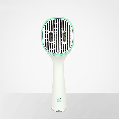 Handheld hair dryer with green accents on a white background