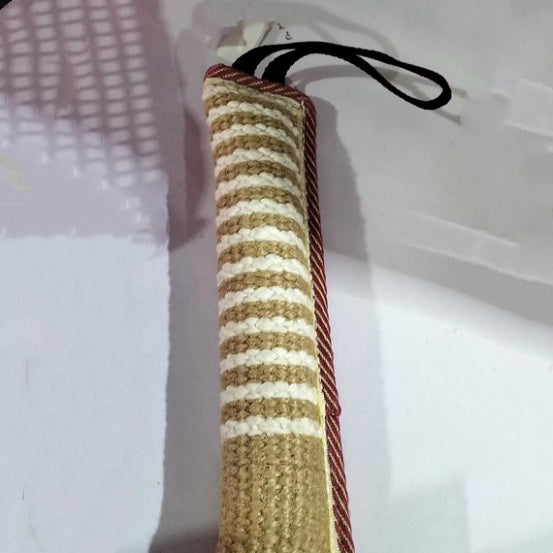 Striped dog toy with a handle on a white background