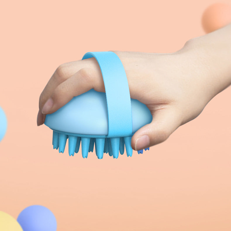 Hand holding a blue scrubber against a peach background
