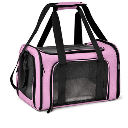 Pink pet carrier with black straps on a white background