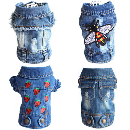 Denim dog coat with bee and strawberry designs on a white background