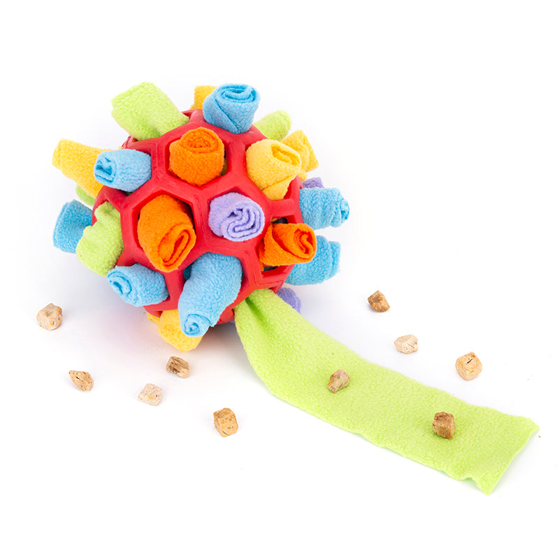 Colorful textured ball toy with a green ribbon on a white background