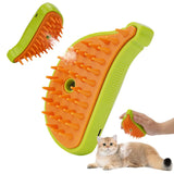 Pet grooming brush with orange bristles and green handle, showing use on a cat.