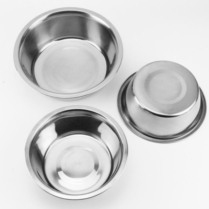 Three stainless steel bowls on a white background
