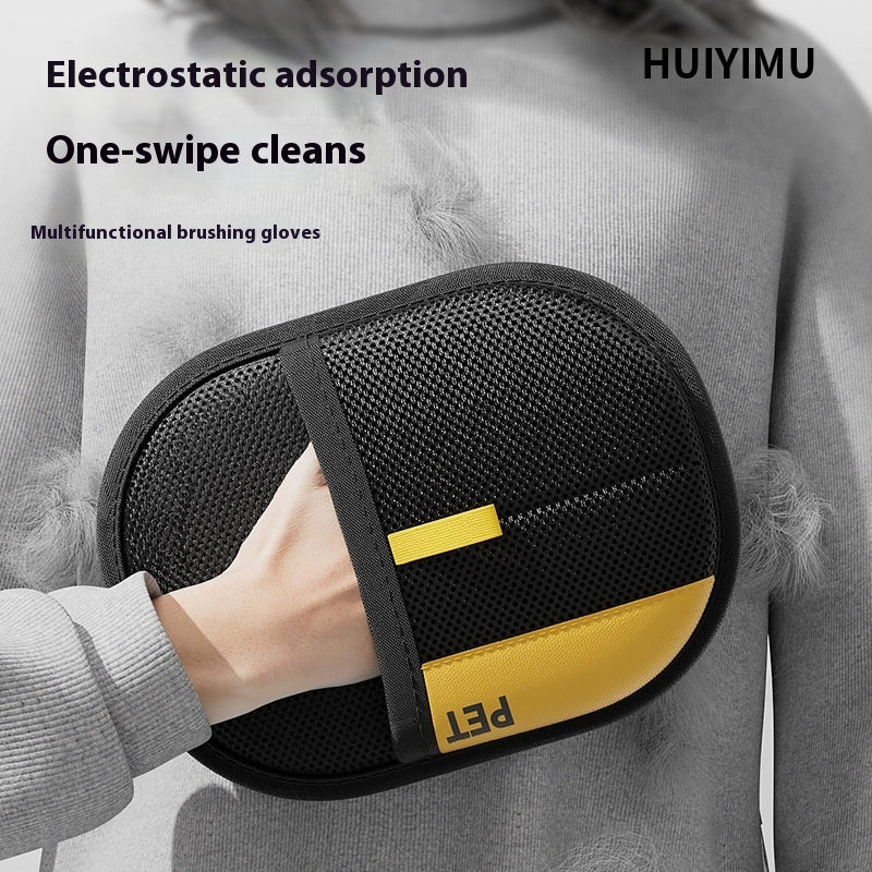 Multifunctional brushing gloves with black and yellow design held by a person, featuring the brand 'HUIYIMU'.
