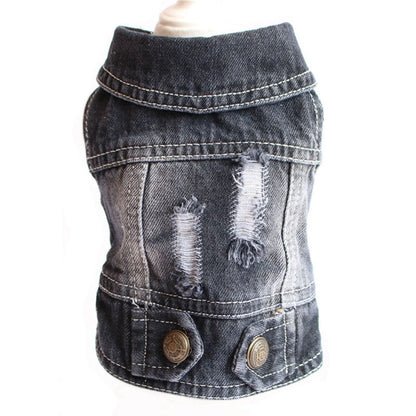 Denim dog vest with distressed details on a white background