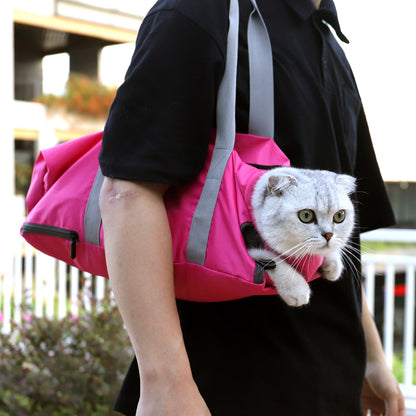 Person carrying a pink pet carrier with a white cat peeking out outdoors.