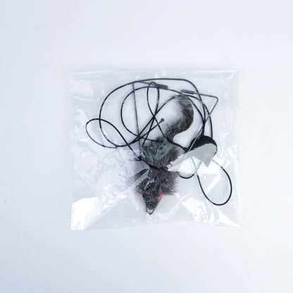 Mouse trap in a clear plastic bag on a white background