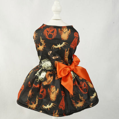 Halloween-themed pet dress with pumpkins, ghosts, and spiders on a mannequin against a white background.